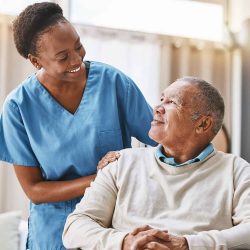 Nurse Smiling at Nursing Home Resident
