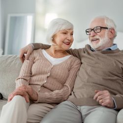 View of independent seniors sitting on couch